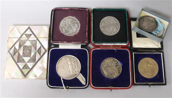 A mother of pearl and white metal-inlaid card case, an 1890 American silver dollar, sundry medals, etc.,